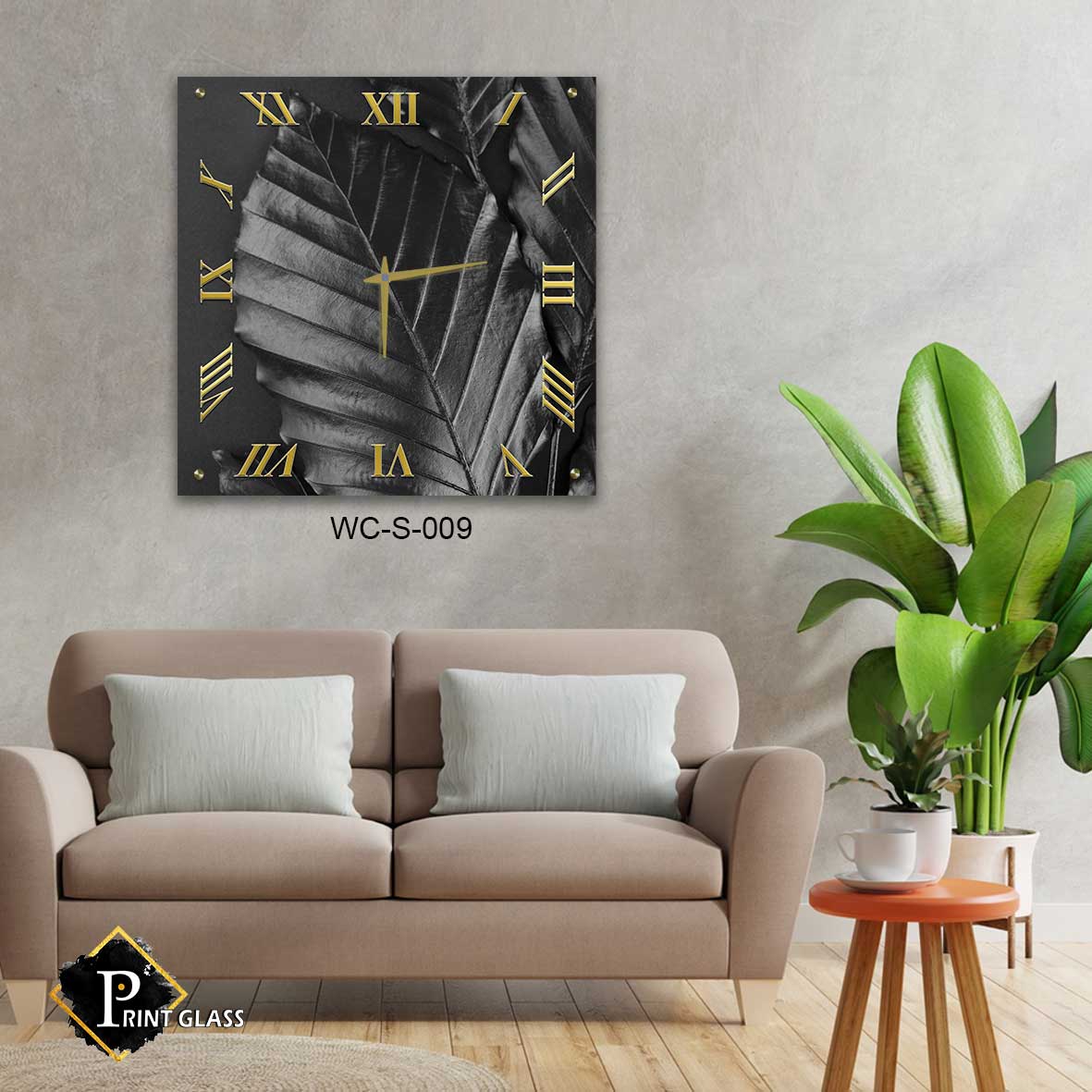 שעון קיר שחור לסלון מזכוכית ברקע עלים