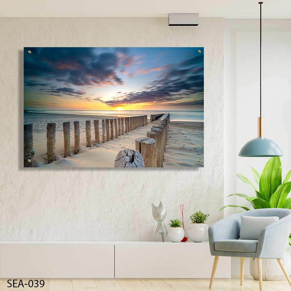 תמונה לסלון של שקיעה על חוף ים עם שובר גלים מעץ