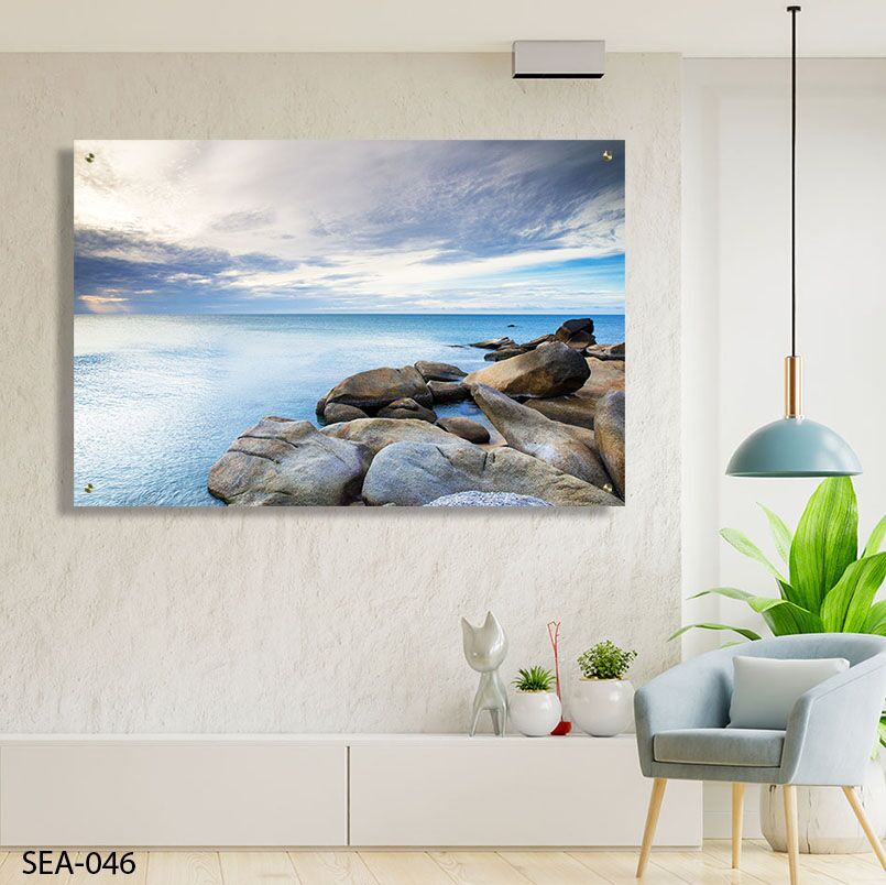 תמונה לסלון של נוף ים רגוע עם סלעים ושמים מעוננים